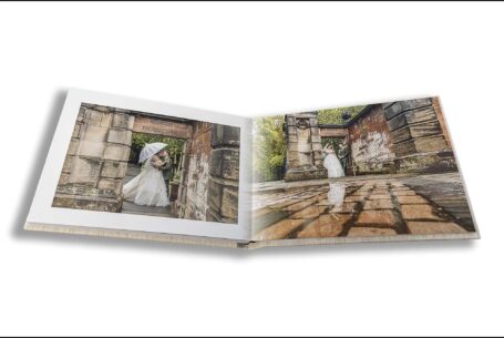 Parents Wedding Album opened at images of Sarah and Lewis in the grounds at Keele Hall in Staffordshire on their wedding day.