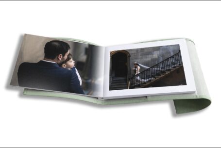 Nicole and Nicholas’s Wedding Album opened at pages showing images leading up to the wedding ceremony at Ashridge House