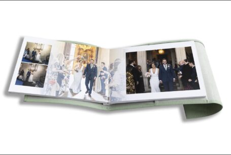 Nicole and Nicholas’s Wedding Album opened at pages showing images of their Hertfordshire wedding ceremony.