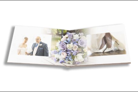 Emily and Jason’s Wedding Album opened at pages showing the bride and her father before the Milton Keynes wedding ceremony