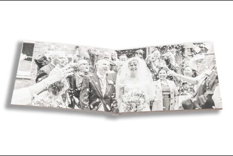 Emily and Jason’s Wedding Album opened at images of the happy couple being showered with confetti