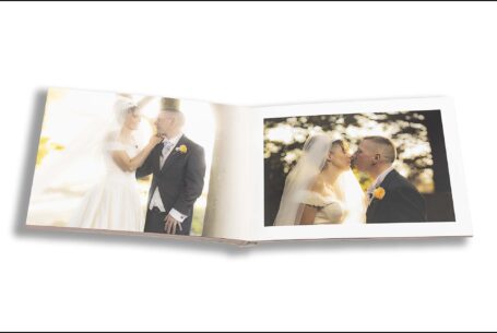 Emily and Jason’s Wedding Album opened at images of the couple in the sunshine on their wedding day at The Holiday Inn Milton Keynes in Buckinghamshire