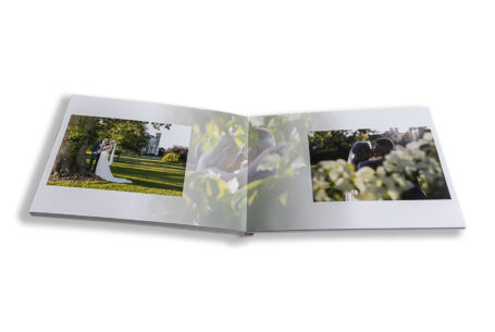 Zoe and Josh’s Wedding Album opened at images of the newlyweds in the sunlit grounds at Ashridge House, Hertfordshire.