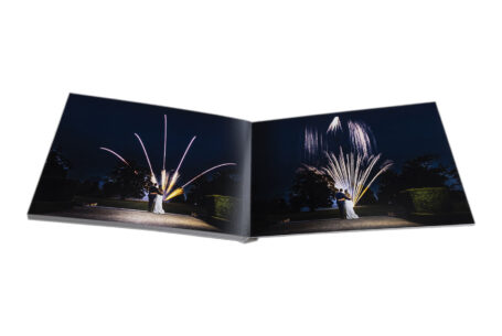 Zoe and Josh’s Wedding Album opened at images of the happy couple watching a fireworks display for their special day at Ashridge House, Hertfordshire.