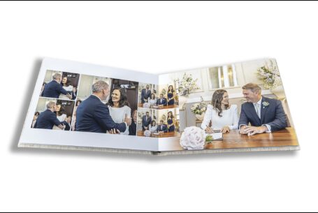 Amanda and Alex’s wedding album showing images of the couple signing the wedding register.