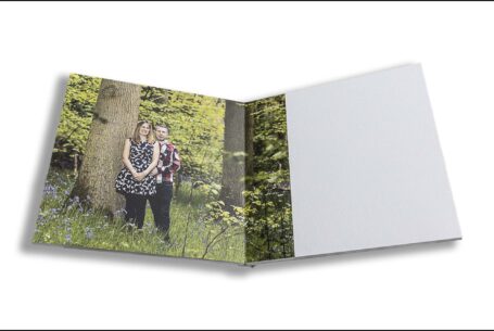 Emily and Jason's Wedding Guest Book showing an image of the couple in a bluebell wood in Northamptonshire