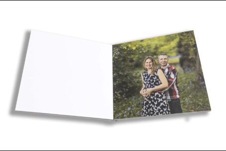 Emily and Jason's Wedding Guest Book showing an image of the couple surrounded by bluebells in a wood in Northamptonshire