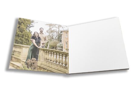 Elly and Olly’s pre-wedding shoot guest book opened at an image of them in the grounds at Kilworth House in Leicestershire
