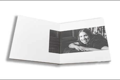 Elly and Olly’s pre-wedding shoot guest book opened at an image of Eleanor the bride-to-be. Photo by John Fox Wedding Photography at Kilworth House.