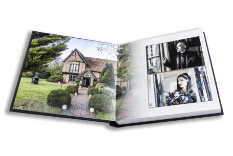 Wedding album open at pages of images of Moreteyne Manor and Louise and Jason's preparations on their special day.