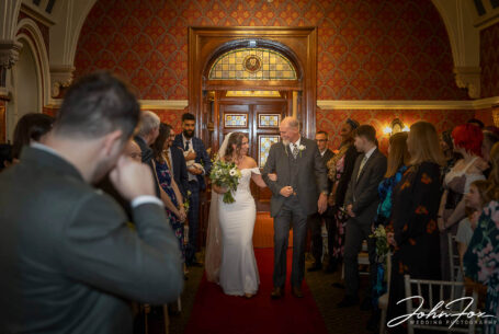 Eleanor and Oliver's Wedding Ceremony at Kilworth House in Leicester. Oliver crying tears of joy as his bride enters the room with her father.