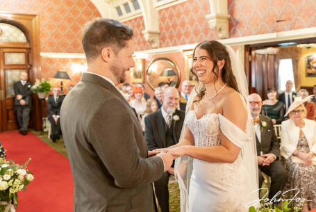 Eleanor and Oliver's Wedding Ceremony at Kilworth House in Leicester. Huge smiles from the bride and groom.