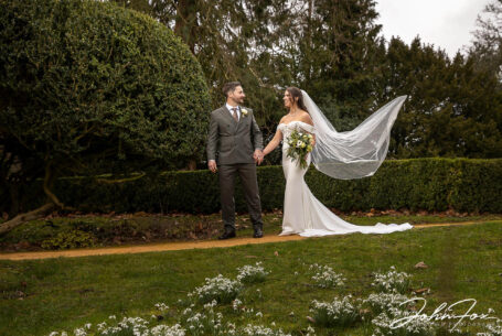 Eleanor and Oliver in the grounds at Kilworth House in Leicester. The breeze catching Eleanor's veil.