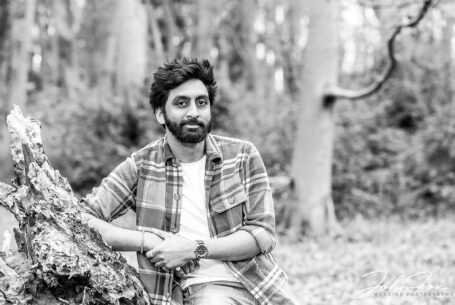 Woodland pre-wedding shoot image of the groom Roshan in Warwickshire