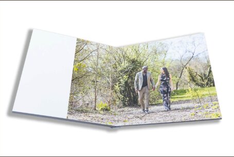 Wedding Guest Book Image of Phil and Figan walking and holding hands in a woodland setting in Buckinghamshire.