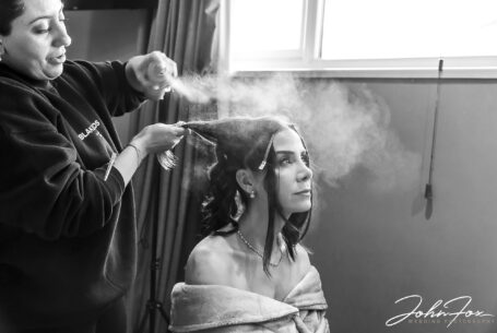 Figan with her hair stylist during her bridal preparations. John Fox Wedding Photographer Milton Keynes, Buckinghamshire
