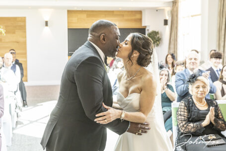 Figan and Philip’s Wedding ceremony first kiss at Abbey Hill Golf Centre, Milton Keynes, Buckinghamshire