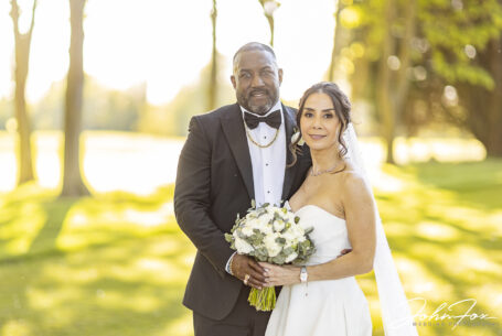 Bride and groom in the grounds at Abbey Hill Golf Centre, Milton Keynes, Buckinghamshire. Image by John Fox.