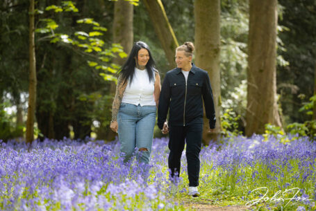 The happy couple-to-be in a Warwickshire woodland. Image by John Fox Wedding Photography.