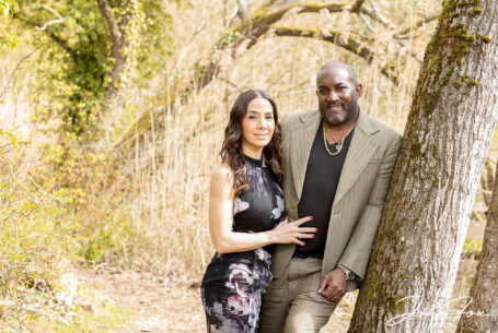 A Relaxed Pre-Wedding Session in Buckinghamshire for Figan and Philip. The happy couple leaning against a tree.