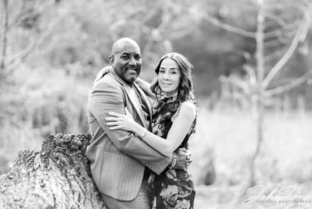 Pre-wedding shoot in parkland in Milton Keynes. Black and white image of Figan and Philip holding each other.