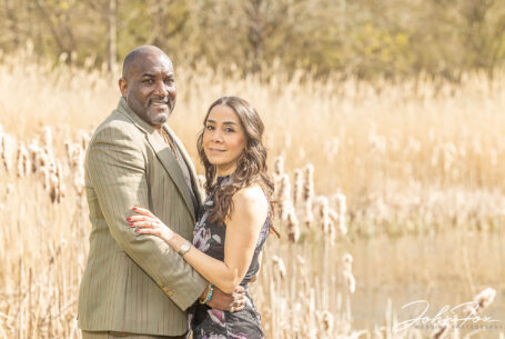 Figan and Philip’s Pre-Wedding Shoot in Milton Keynes. The couple-to-be holding each other by a lake.