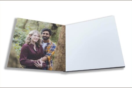 Isobel and Roshan’s Guest Book images. The couple holding each other and smiling for the camera on their pre-wedding shoot in Rugby, Warwickshire.
