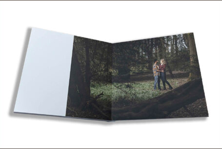 Isobel and Roshan’s Guest Book images. The couple embracing amongst the trees on their pre-wedding shoot in Rugby, Warwickshire